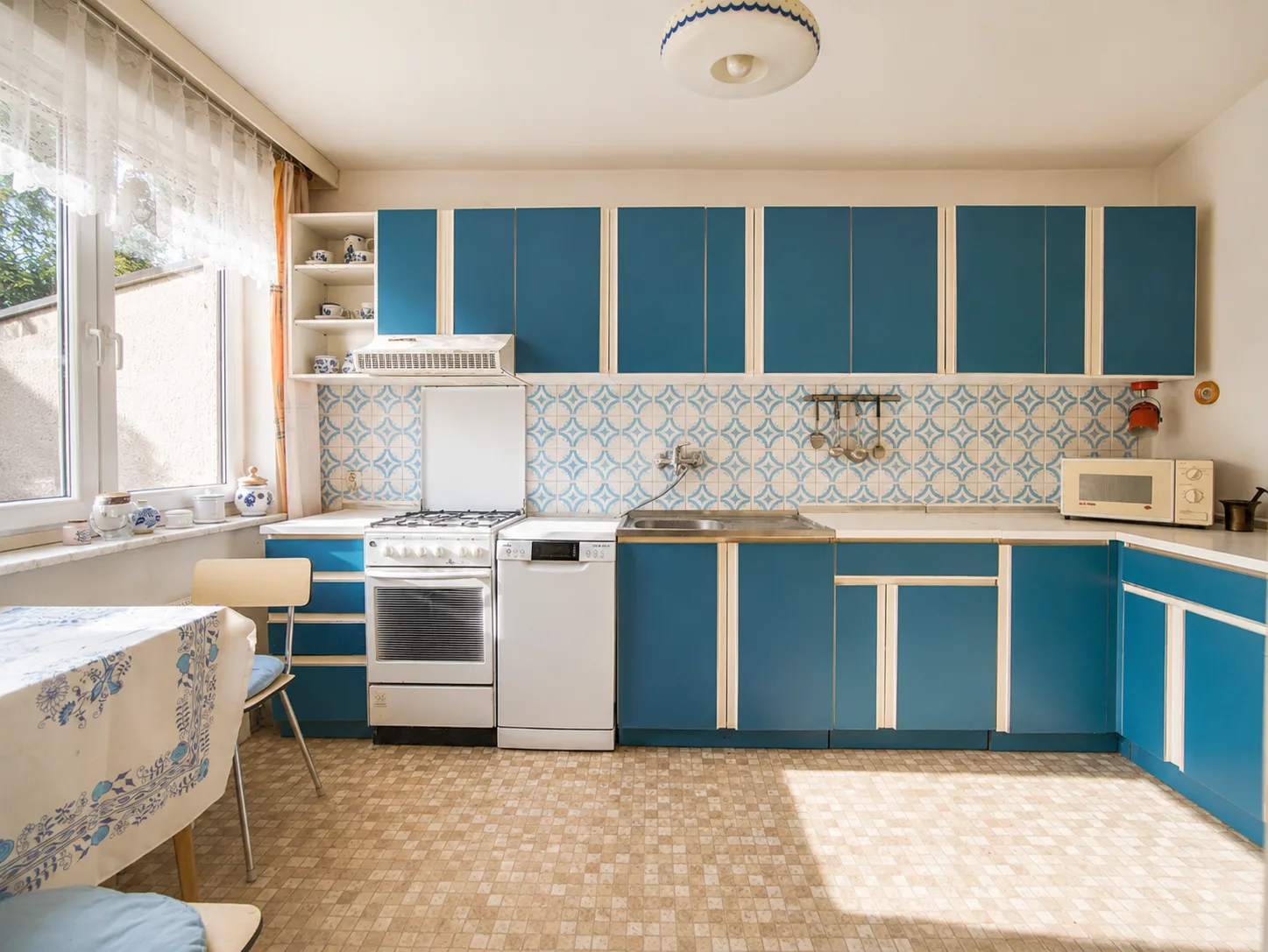 Retro blue kitchen with original tiled splashback
