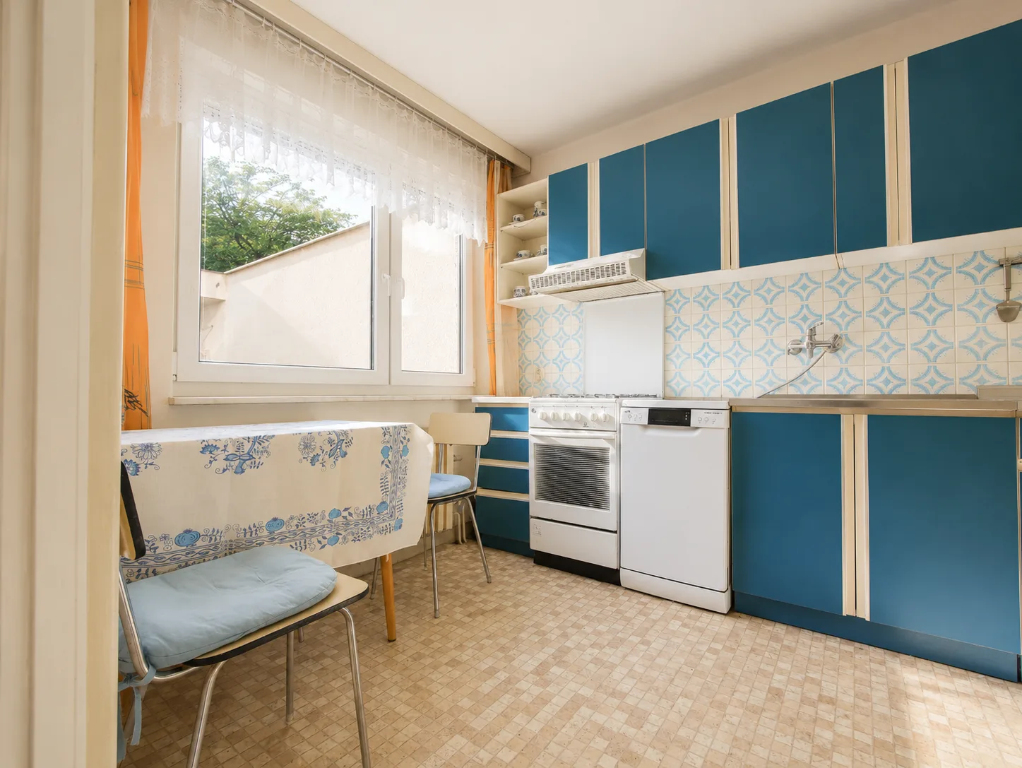 Kitchen with dining nook by the window
