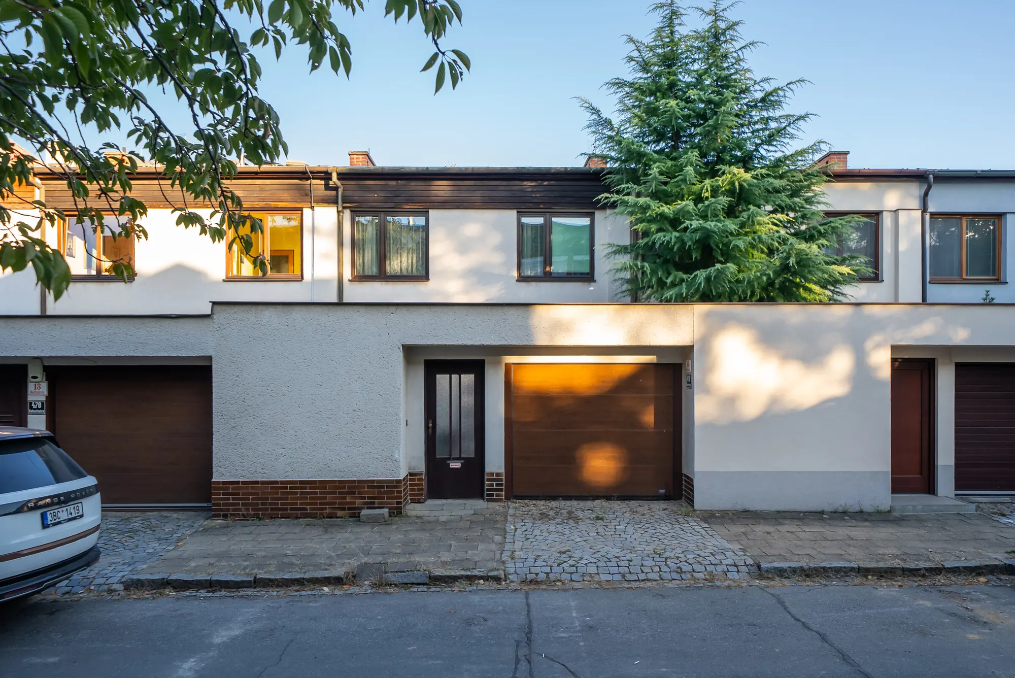 Street front of the house with the garage